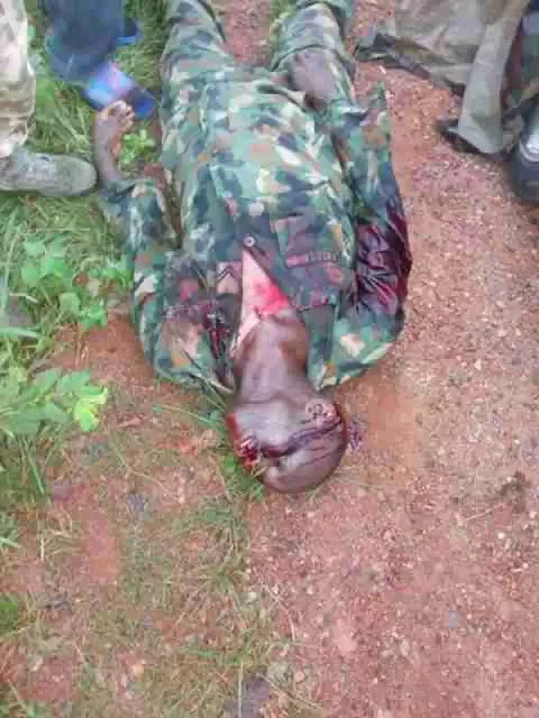 HORRIBLE!! This Soldier Traveling From Kaduna To Abuja Was Killed By 2 Men While Fixing His Tyre [Graphic Photos]